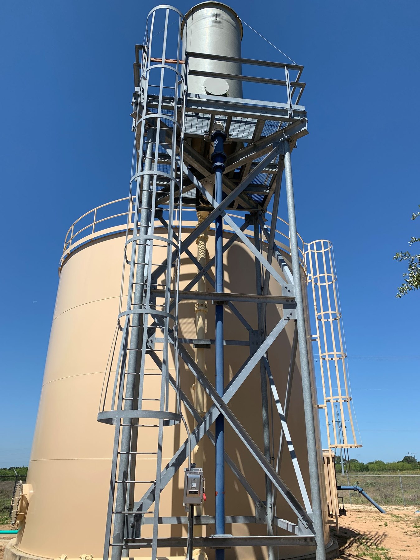 WETS aerator mounted above a ground storage tank