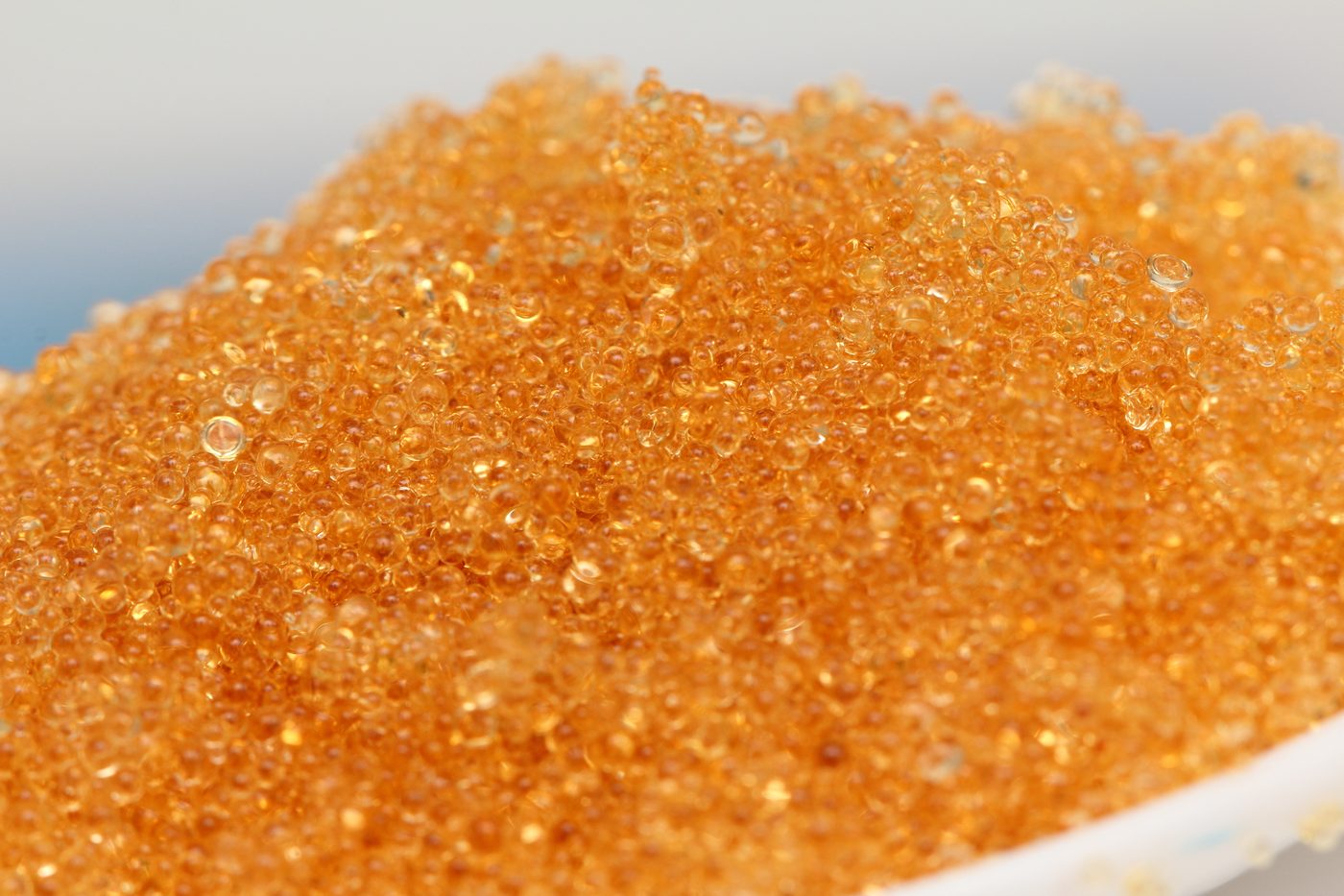 Close-up of amber ion exchange resin beads