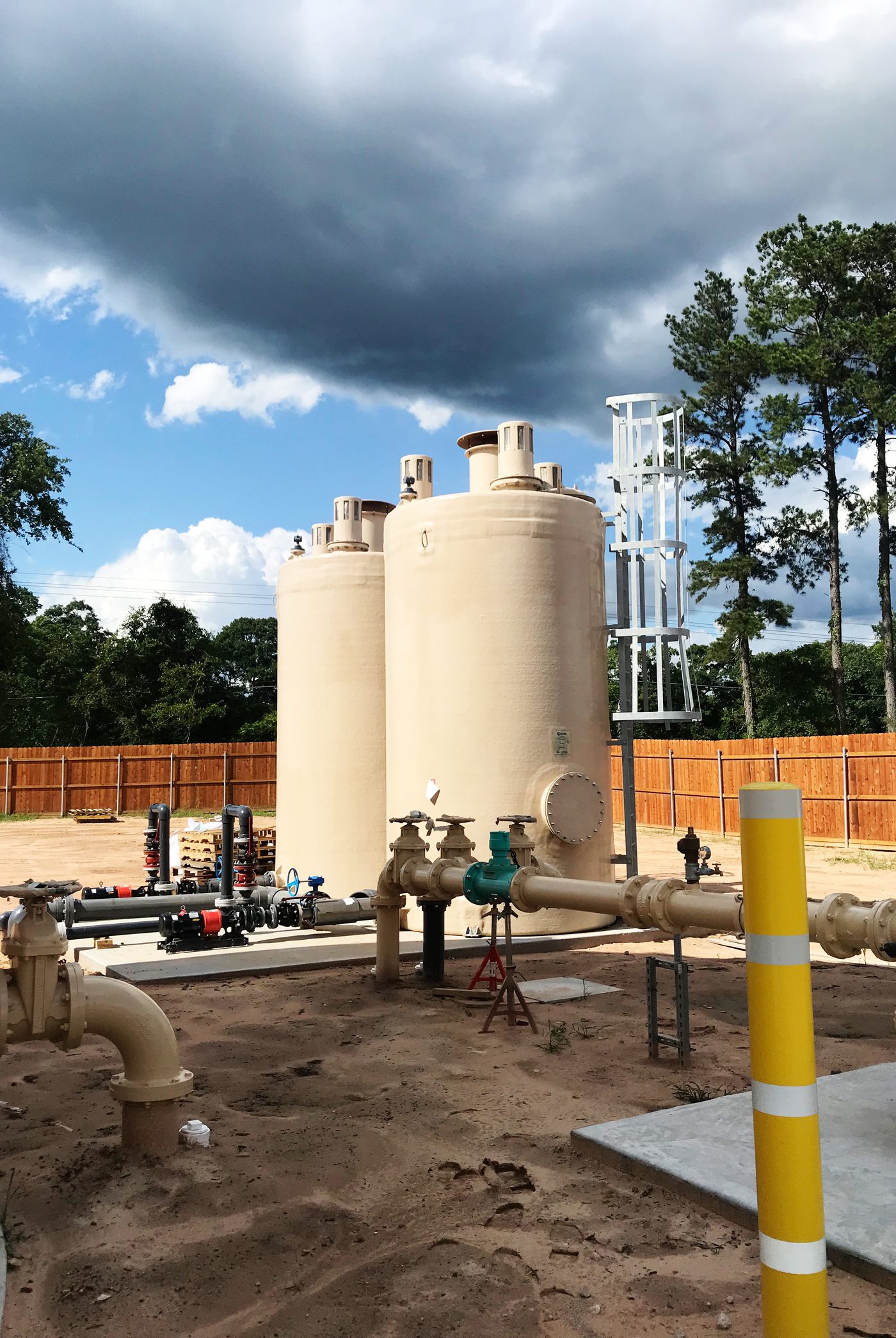 Twin WETS WAFU treatment vessels installed on a concrete pad with site pipework